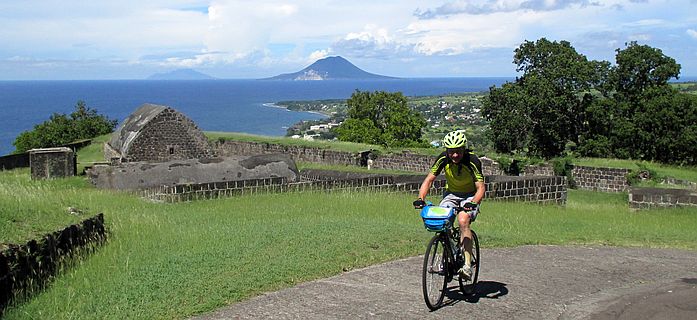 Chris on the Bike climbing Brimstone Hill Fortress, St. Kitts 